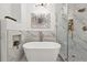 Luxury bathroom with soaking tub, walk-in shower with marble tile, and stylish fixtures at 6212 Kilmer Loop # 202, Golden, CO 80403