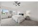 Bright main bedroom features a ceiling fan, neutral decor, and large windows at 6212 Kilmer Loop # 202, Golden, CO 80403