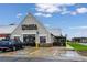 A restaurant exterior with a welcoming entrance and ample parking, set against a partially cloudy sky at 6212 Kilmer Loop # 202, Golden, CO 80403