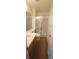 Cozy bathroom features a vanity with solid countertops and a shower with glass enclosure at 10129 Grove Ct # B, Westminster, CO 80031