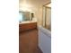 Primary bathroom with double sinks, a soaking tub, and separate glass-enclosed shower at 10129 Grove Ct # B, Westminster, CO 80031