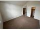 Bedroom featuring neutral carpet, closet and lots of light at 10129 Grove Ct # B, Westminster, CO 80031