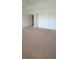Bright bedroom offers closet space, plush carpet and serene ambiance, perfect for relaxation at 10129 Grove Ct # B, Westminster, CO 80031