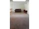 Expansive bonus room offers versatile living space with neutral carpet and access to additional rooms at 10129 Grove Ct # B, Westminster, CO 80031