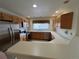 Well-lit kitchen with stainless steel appliances and a breakfast bar that opens to the living area at 10129 Grove Ct # B, Westminster, CO 80031