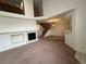 Open concept living room with fireplace and staircase at 10129 Grove Ct # B, Westminster, CO 80031