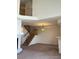 Large living area with fireplace, staircase, and modern chandelier at 10129 Grove Ct # B, Westminster, CO 80031