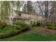 Two-story brick home featuring mature landscaping and a private, tree-lined yard at 4070 S Hudson Way, Englewood, CO 80113