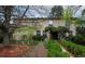 Charming two-story brick home with mature landscaping in a serene, tree-lined neighborhood at 4070 S Hudson Way, Englewood, CO 80113