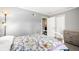 Bedroom featuring a large window, grey walls and closet with sliding doors at 3001 Benton St, Wheat Ridge, CO 80214