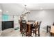 Dining room with table and chairs, eating bar, chandelier and luxury vinyl flooring at 3001 Benton St, Wheat Ridge, CO 80214