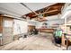 Spacious garage providing ample storage and parking space, complete with a pegboard and overhead door mechanism at 3001 Benton St, Wheat Ridge, CO 80214