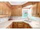 Quaint kitchen featuring ample counter space and stainless steel sink at 3001 Benton St, Wheat Ridge, CO 80214
