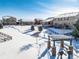 Aerial view of homes and community amenities in winter at 19427 Dunraven St, Parker, CO 80134