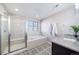 Bathroom with soaking tub, walk-in shower, and granite vanity at 19427 Dunraven St, Parker, CO 80134