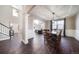 Formal dining room with hardwood floors and a view of the entryway at 19427 Dunraven St, Parker, CO 80134