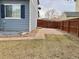 Grassy backyard featuring a stone pathway, partial fence and easy access to the side yard at 1022 Morning Dove Dr, Longmont, CO 80504