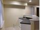 Basement kitchenette equipped with a sink, countertop, and cabinet space for convenience at 1022 Morning Dove Dr, Longmont, CO 80504