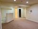 Spacious finished basement featuring neutral carpet and open doorways at 1022 Morning Dove Dr, Longmont, CO 80504