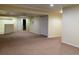 Spacious basement area perfect for recreation, complete with neutral carpeting and a bonus room at 1022 Morning Dove Dr, Longmont, CO 80504