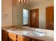 Bathroom with double sinks, large mirror, and plenty of light, offers both style and functionality at 1022 Morning Dove Dr, Longmont, CO 80504