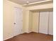 Bedroom with neutral carpet, white trim, white doors, and overhead lighting at 1022 Morning Dove Dr, Longmont, CO 80504