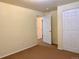 Bedroom featuring neutral walls, a closet and an open doorway creating a welcoming atmosphere at 1022 Morning Dove Dr, Longmont, CO 80504