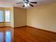 Bright, spacious bedroom with hardwood floors and a modern ceiling fan at 1022 Morning Dove Dr, Longmont, CO 80504
