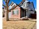 Charming two-story home with blue siding, brick accents, and a well-manicured front yard at 1022 Morning Dove Dr, Longmont, CO 80504