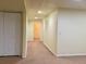 Hallway featuring neutral carpet, white trim, white doors, and recessed lighting at 1022 Morning Dove Dr, Longmont, CO 80504