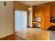 Cozy eat-in kitchen area with sliding glass doors and honey oak cabinets with complementing countertops at 1022 Morning Dove Dr, Longmont, CO 80504