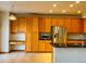 Spacious kitchen has a built-in desk, stainless steel appliances, including a refrigerator and microwave, and ample counter space at 1022 Morning Dove Dr, Longmont, CO 80504