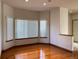 Bright, airy living room featuring hardwood floors and large windows that provide plenty of natural light at 1022 Morning Dove Dr, Longmont, CO 80504