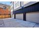 Spacious three-car garage with a concrete driveway at 5128 W 26Th Ave # 101, Denver, CO 80212