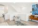 Cozy living area with comfortable seating, modern decor, and light hardwood floors, perfect for relaxation at 5128 W 26Th Ave # 101, Denver, CO 80212