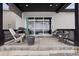 Inviting back porch with ample seating, a barbecue grill, and sliding glass doors that open to the living area at 5622 Shadescale Way, Castle Rock, CO 80104