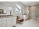 Elegant bathroom featuring dual vanities, a frameless glass shower, and contemporary fixtures for a luxurious experience at 5622 Shadescale Way, Castle Rock, CO 80104