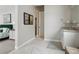 Bathroom with a large white vanity, light gray walls and floor, and decor at 5622 Shadescale Way, Castle Rock, CO 80104