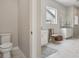 Bright bathroom featuring dual vanities, a soaking tub, and a separate walk-in shower with modern fixtures at 5622 Shadescale Way, Castle Rock, CO 80104