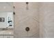 Modern bathroom featuring a stone tile shower with glass partition and matte black fixtures and fixtures at 5622 Shadescale Way, Castle Rock, CO 80104