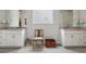 Bathroom with a large white double vanity, light gray walls and floor, and decor at 5622 Shadescale Way, Castle Rock, CO 80104
