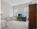 Bedroom with two large windows and two desks, with an armoire on one side at 5622 Shadescale Way, Castle Rock, CO 80104