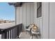 Cozy front porch with a comfortable chair, decorative lanterns, and a scenic neighborhood view at 5622 Shadescale Way, Castle Rock, CO 80104