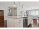 Modern kitchen island with quartz countertops, stainless steel appliances, and pendant lighting at 5622 Shadescale Way, Castle Rock, CO 80104