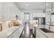 Bright kitchen with stainless steel appliances, quartz countertops, and ample cabinet space at 5622 Shadescale Way, Castle Rock, CO 80104