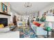 Bright, open-concept living room featuring stylish furnishings, an ornate fireplace, and an inviting atmosphere for relaxation at 5622 Shadescale Way, Castle Rock, CO 80104