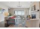 Bright, open-concept living room featuring stylish furnishings, an ornate fireplace, and an inviting atmosphere for relaxation at 5622 Shadescale Way, Castle Rock, CO 80104