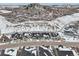 Street view of the neighborhood homes with snow covered lawns and landscaping at 5622 Shadescale Way, Castle Rock, CO 80104