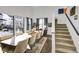 Sunlit dining room with sliding glass doors and hardwood floors at 11220 Bellsong Ln, Littleton, CO 80125