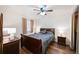 Comfortable bedroom features a ceiling fan, and warm accents, with plenty of natural light at 857 S Van Gordon Ct # I207, Lakewood, CO 80228